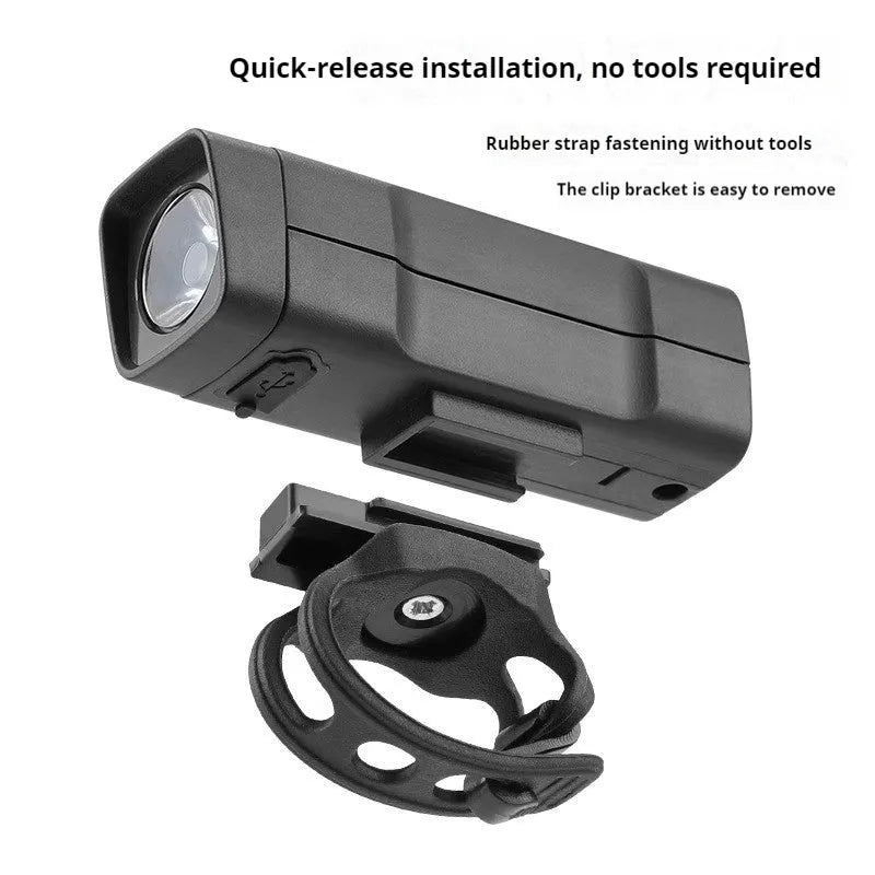 USB rechargeable bicycle headlight with LED lamp and quick release strap bracket on handlebars.