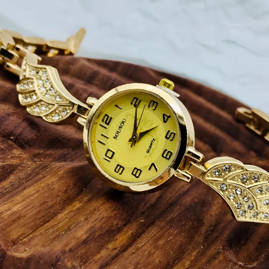 Women's stainless steel watch with round dial and 9mm thickness showing gold face option