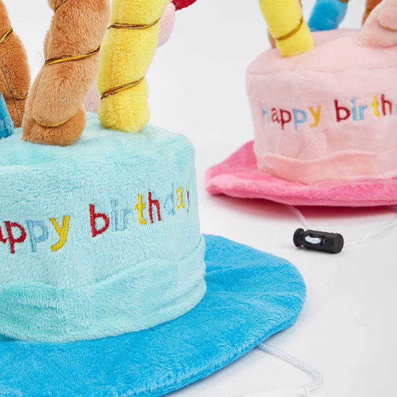 A blue or pink birthday hat for toy dogs on a white background.