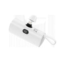 Capsule-shaped wireless power bank with digital display and integrated plug, shown in multiple colours.