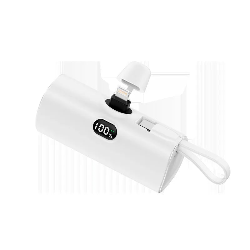 Capsule-shaped wireless power bank with digital display showing battery percentage