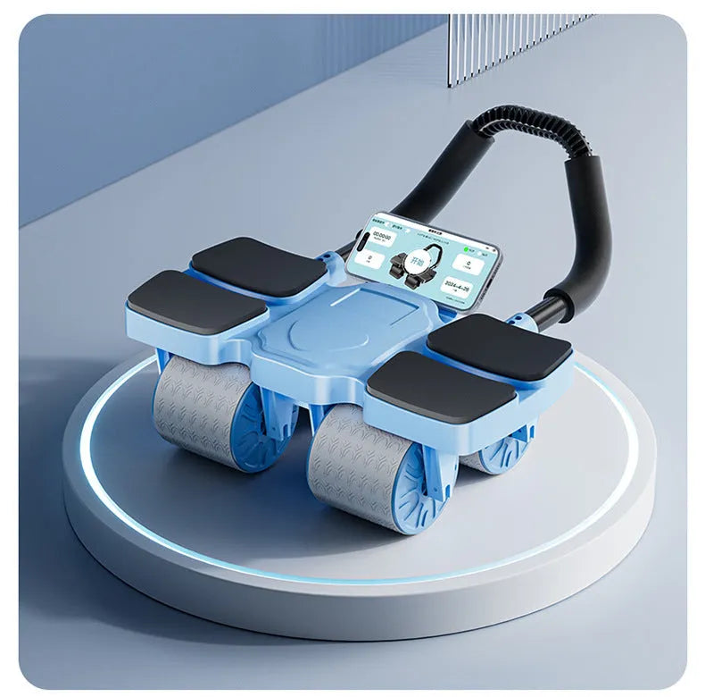 Black abdominal wheel with automatic rebound, four blue wheels, and ergonomic rubber handles on a gym mat.