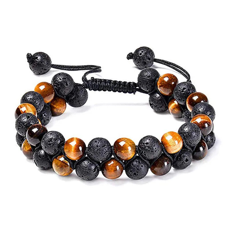 Matte black agate bead couple bracelets with geometric design on a plain background.