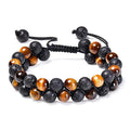 Matte black agate bead couple bracelets with geometric design on a plain background.