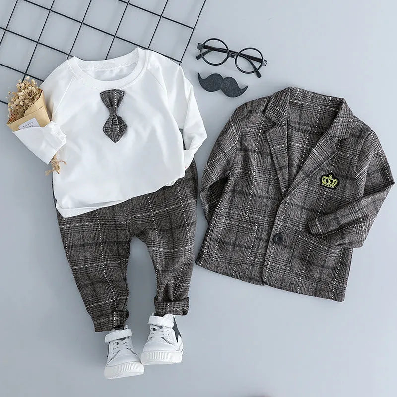 Grey three-piece children's suit with blazer, waistcoat, and trousers on a hanger.