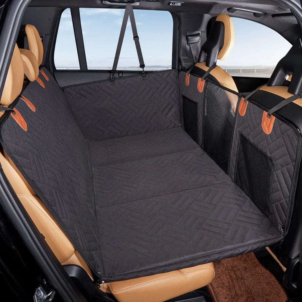 Black waterproof car dog bed cushion on rear seats protecting against pet mess