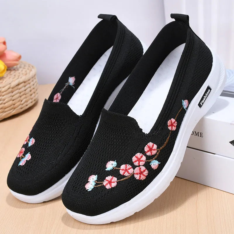 Women's woven floral embroidery casual pumps with a low heel and round toe in wine red colour.