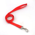 Solid colour nylon dog hand holding rope and tug toy in various colours and sizes.