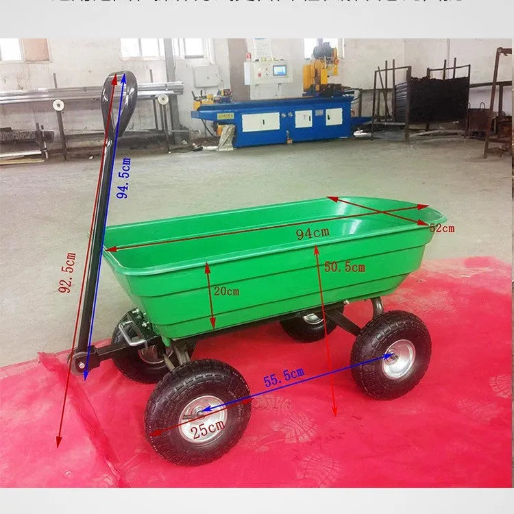 Green four-wheel steel and plastic dump truck with large load bed.