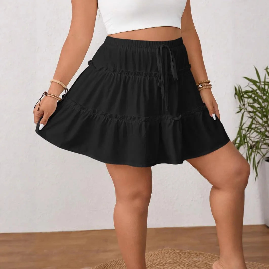 White pleated A-line short skirt with a front lace-up adjustable closure.