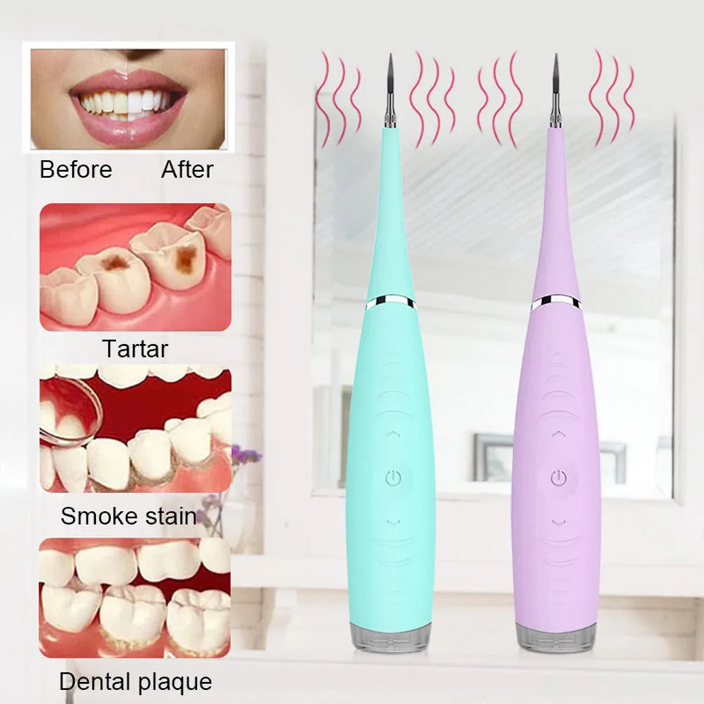 Pink and blue waterproof electric dental scaler with silicone handle and charging cable on a bathroom counter.