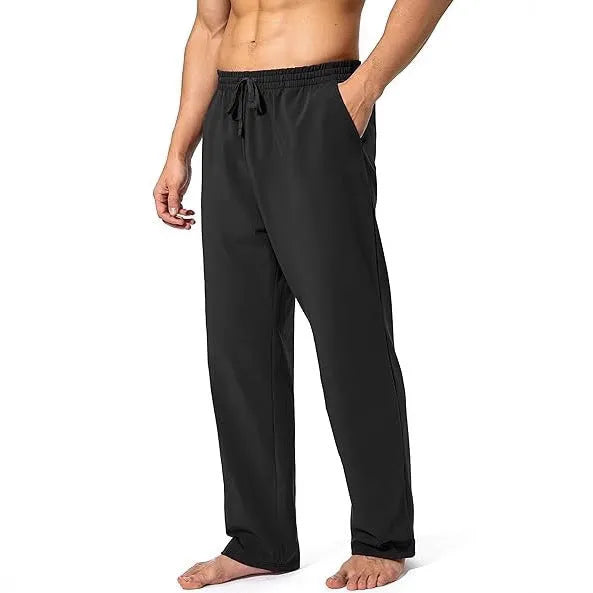 Men's loose fit quick-dry trousers in dark grey colour for sports and leisure activities
