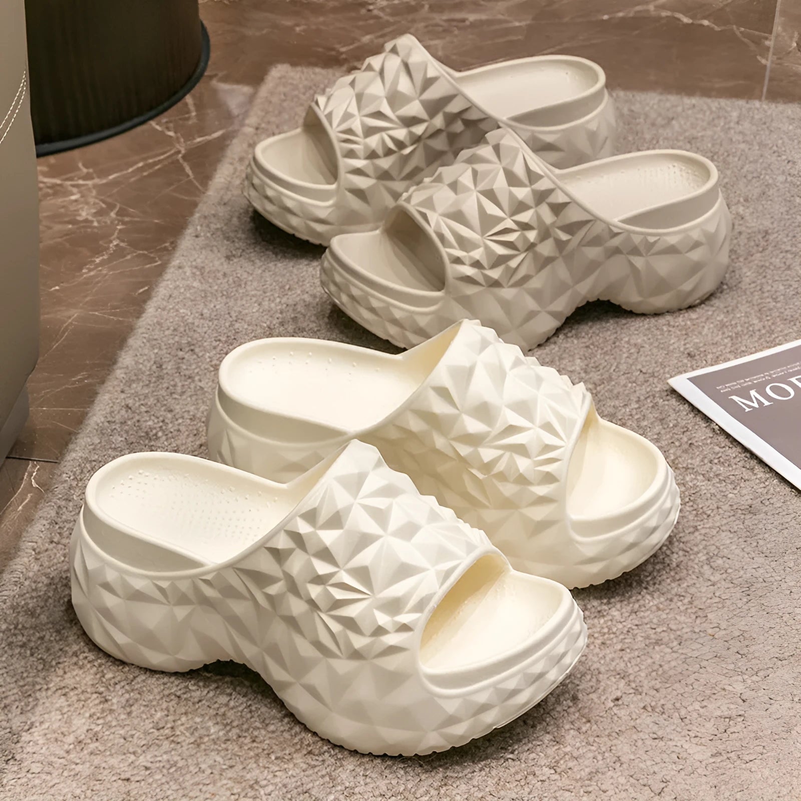 A pair of khaki high heel flip flop slippers made from injection moulded EVA with a thick sole.