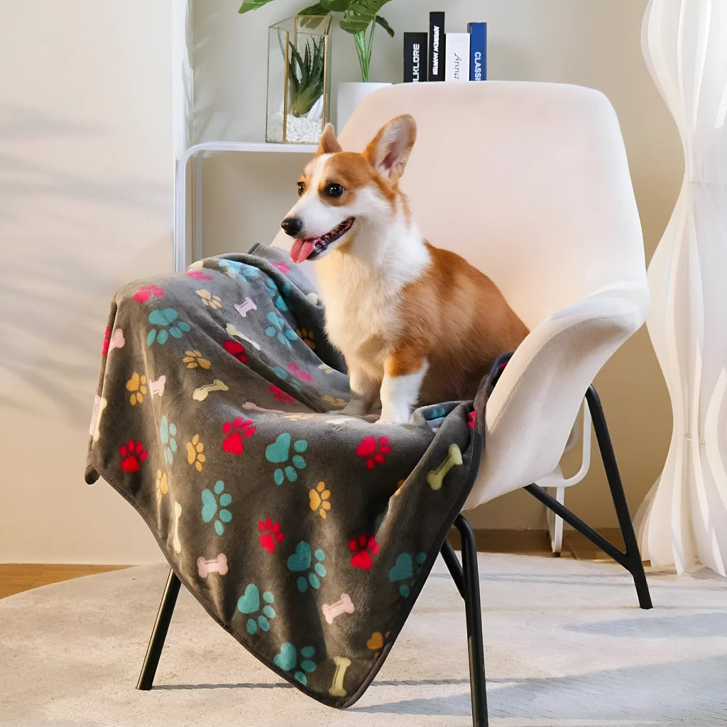 Three flannel coral fleece pet blankets in dark grey, camel, and sky blue stacked together showing size S