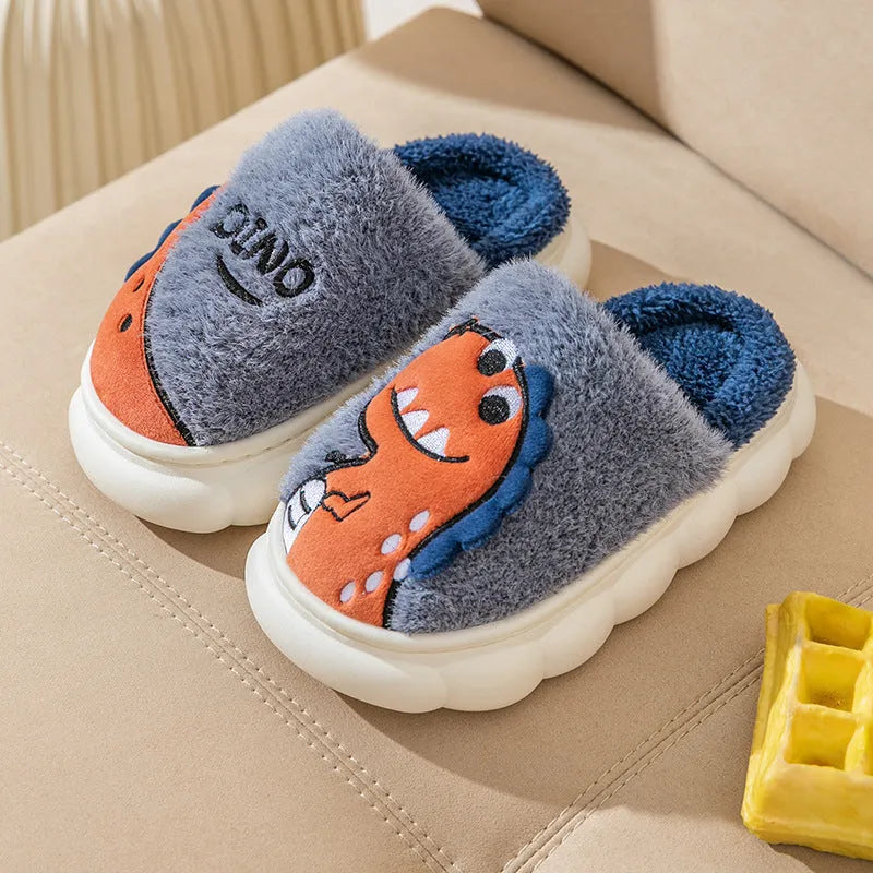 A pair of plush cotton dinosaur-themed slippers for couples, shown in coffee colour.