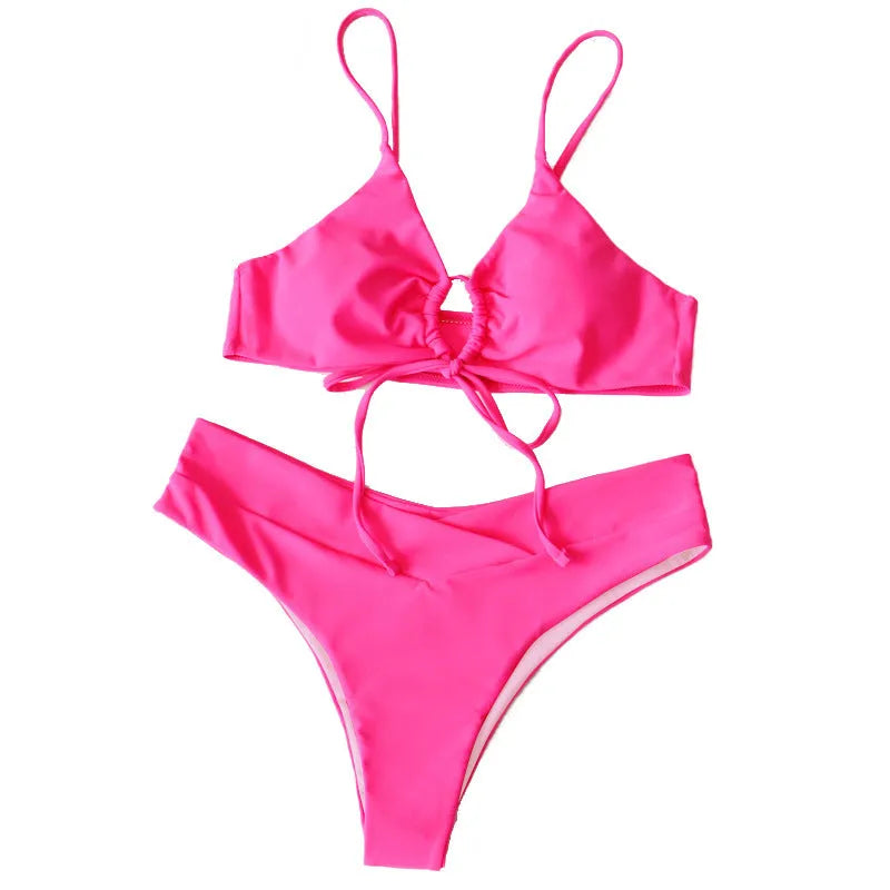 Women's solid colour bikini with a tied bow detail on the split front, shown in multiple colour options.