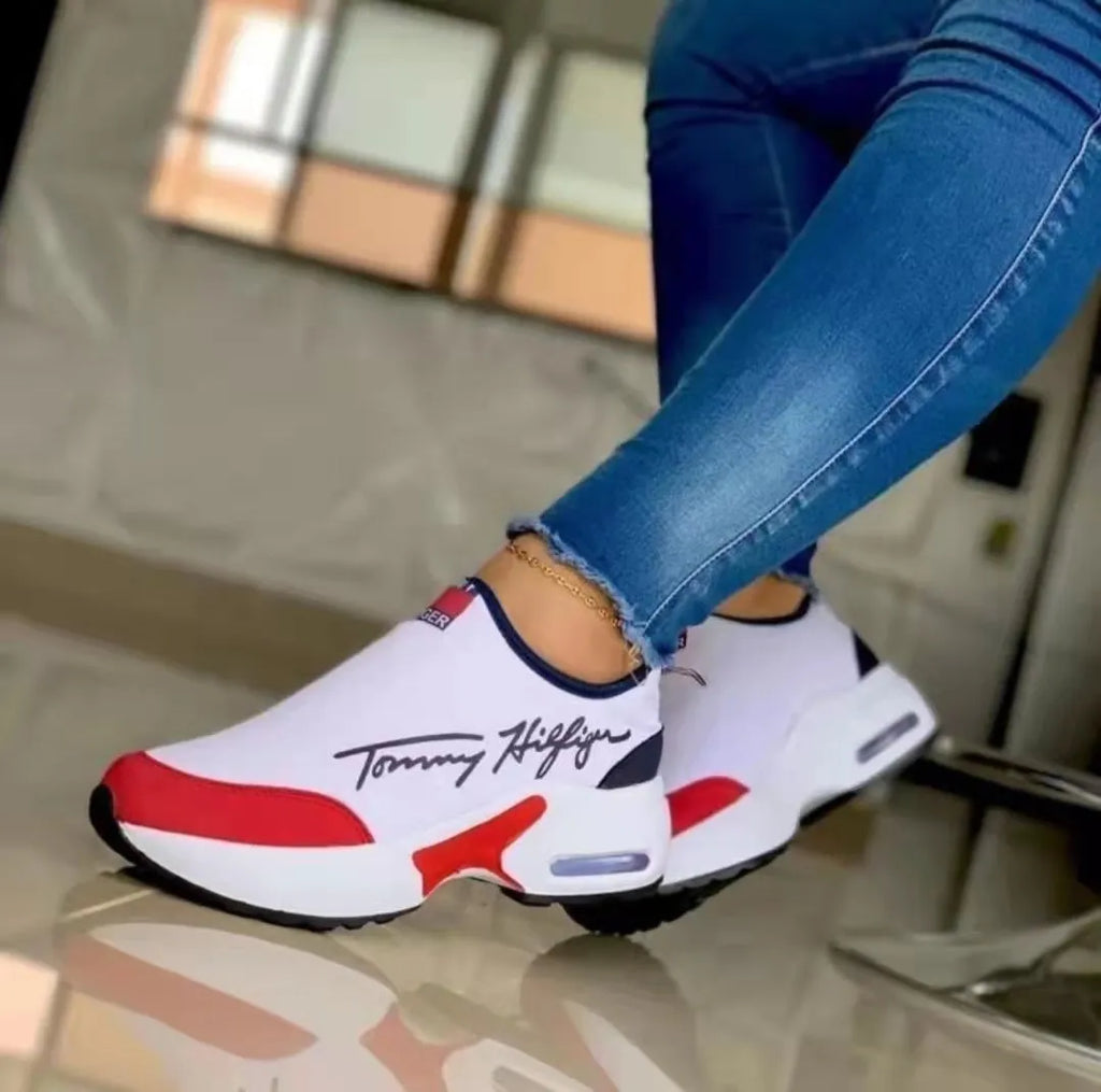 Air cushion slip-on sneakers for women with breathable mesh upper and wedge heel in black