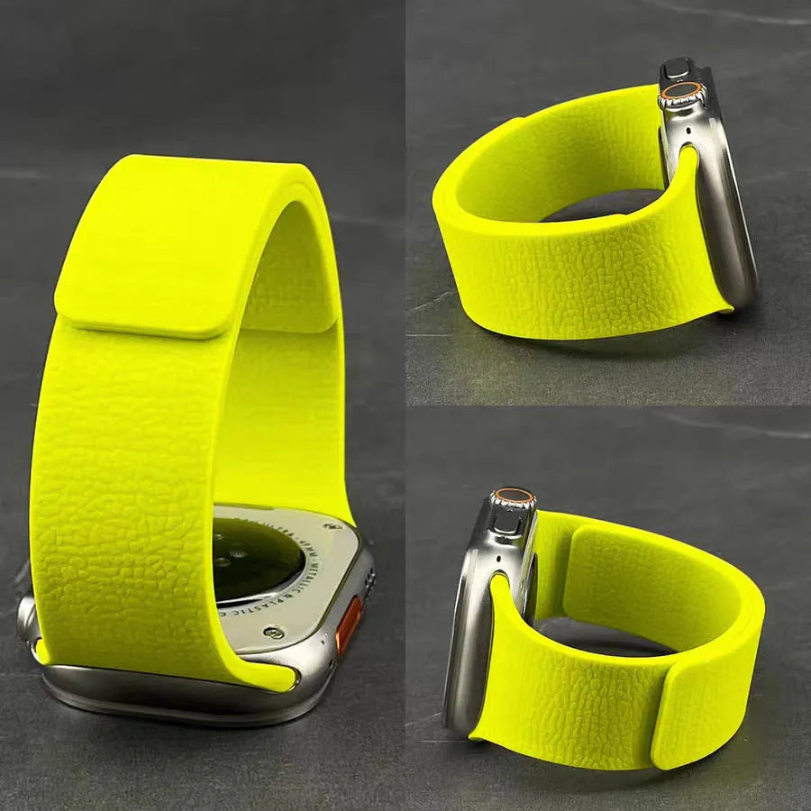 Magnetic silicone Apple Watch strap with litchi pattern, shown in orange, sizes 38-49mm