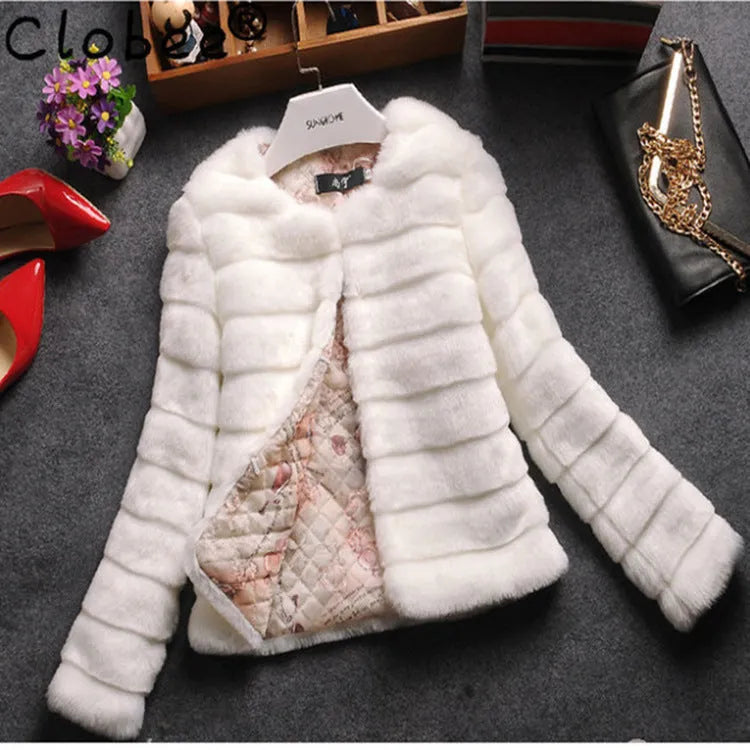 A woman wearing a short white faux fur top with regular sleeves, showcasing a cropped street fashion look.