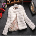 Women's short white faux fur top with regular sleeves on a model.