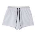 A pair of men's black nylon quick-dry shorts laid flat.