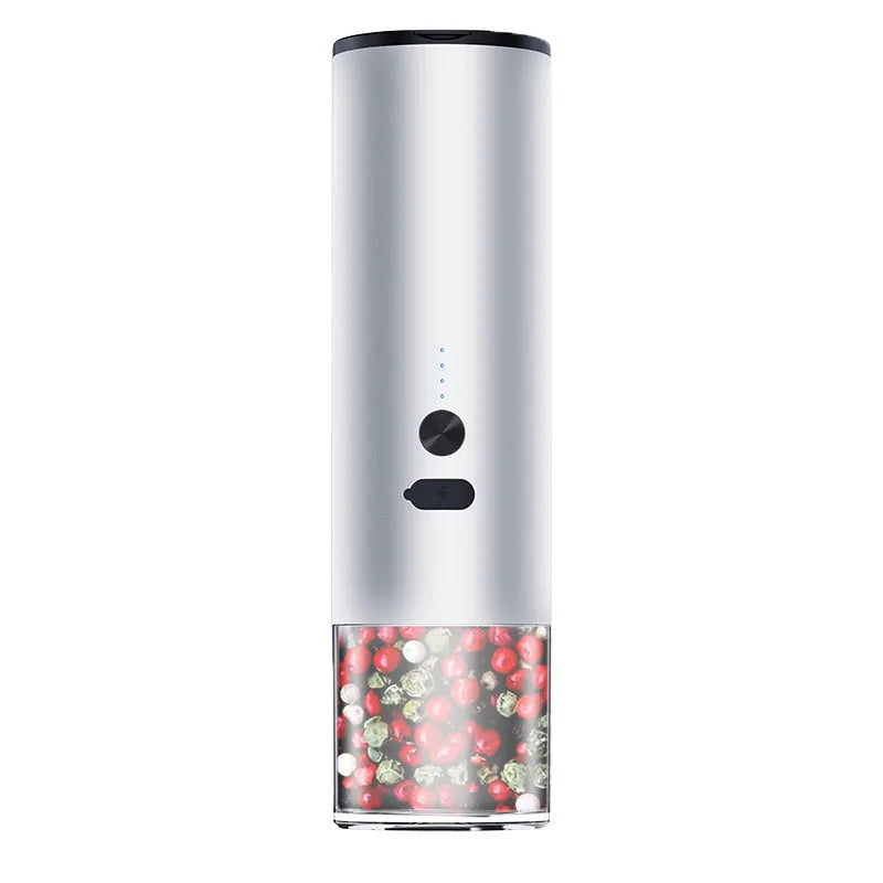 White electric salt and pepper grinder set with clear glass jar and stainless steel top on kitchen counter