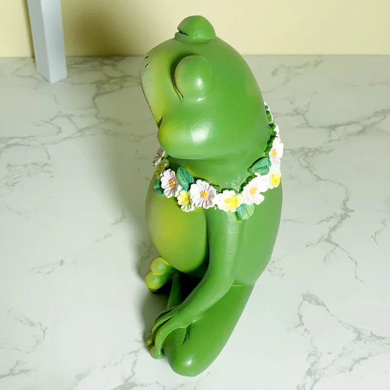 Magic Yoga Frog ornament in RDW123 colour on a desk.