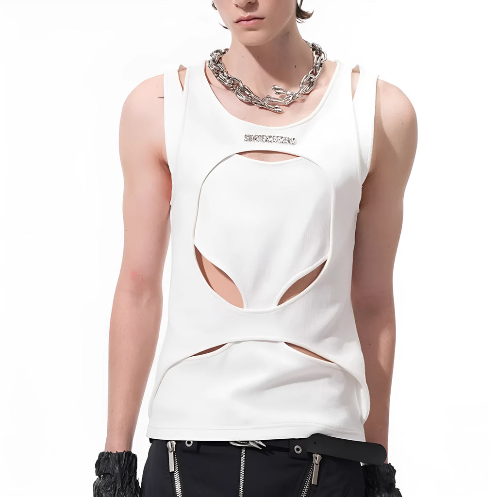 Man wearing a loose-fitting black sleeveless waistcoat with a round neck over a white t-shirt.