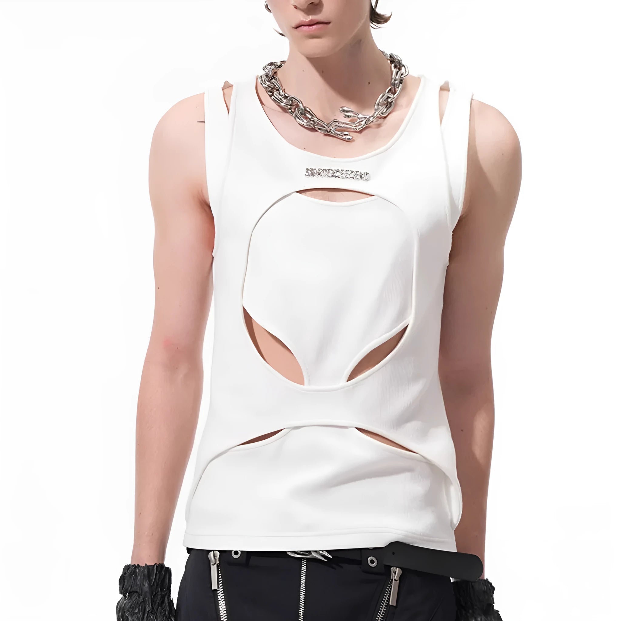 Man wearing a loose-fitting black sleeveless waistcoat with a round neck over a white t-shirt.