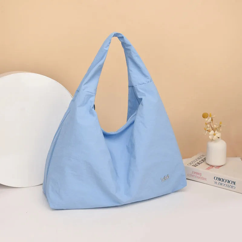 Soft nylon women's underarm bag in heart shape design showing large capacity