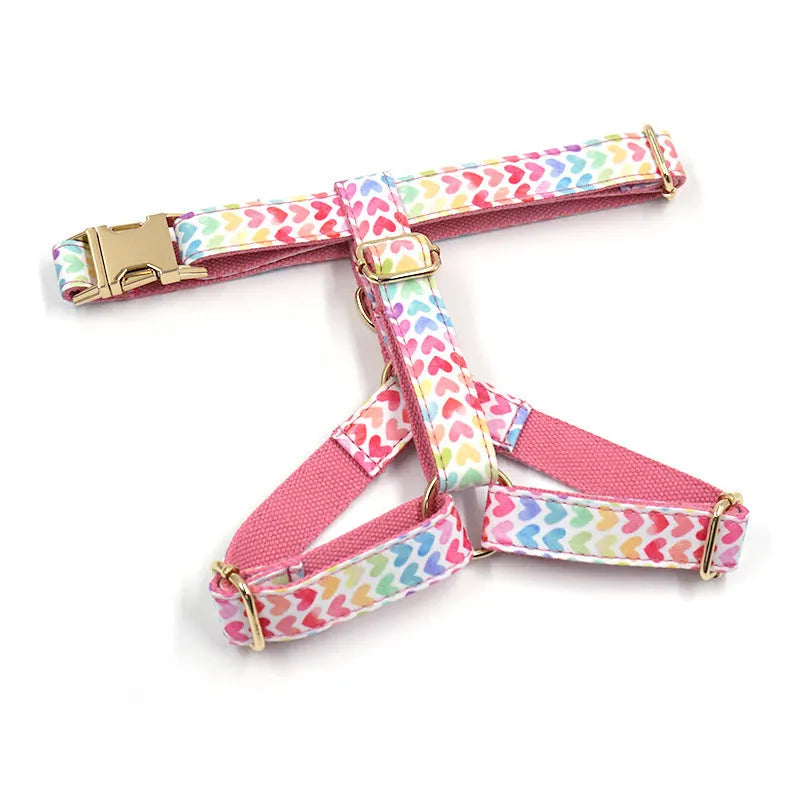 Pink dog harness with gold buckle and colourful heart-shaped crystals for small dogs