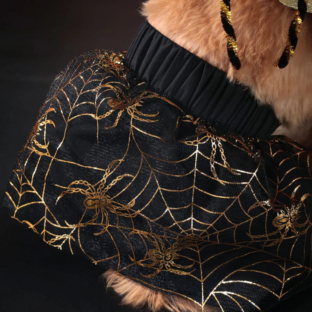 A dog wearing a black and white Halloween suit costume, shown in size L.