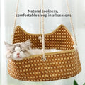 Green rattan cat cage hammock with metal hooks, shown hanging on a shelf.