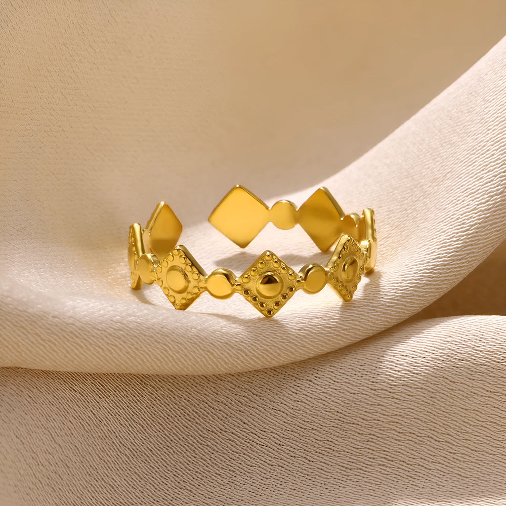 Golden diamond colour titanium steel geometric women's ring on display