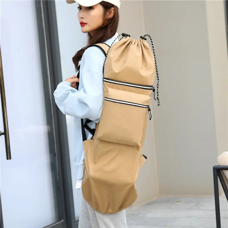 Black waterproof nylon bag for carrying a skateboard and fishing rods on a shoulder strap.