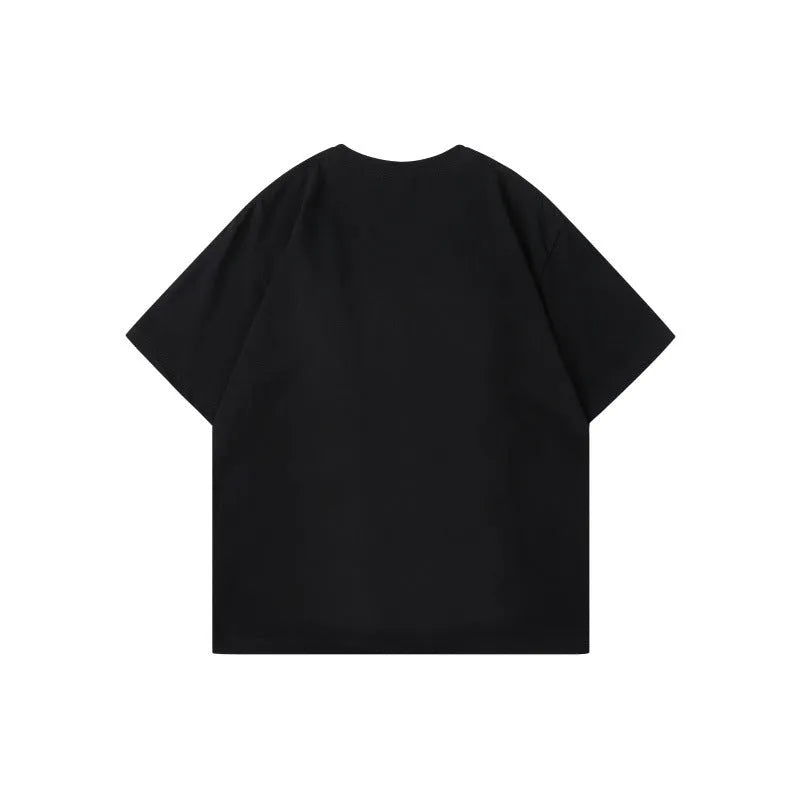 Men's loose grey cotton T-shirt with black and white patchwork letter design on chest.
