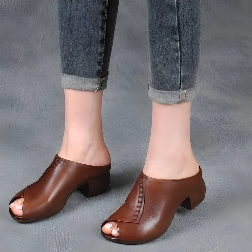 Women's black peep-toe slipper with a square heel and fish mouth opening, shown on a white background.