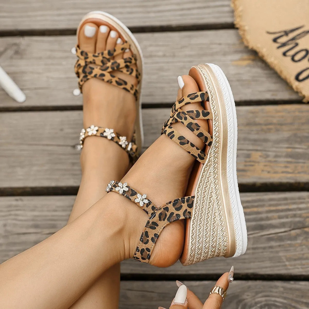 Light brown suede women's sandals with an ankle buckle and platform sole.
