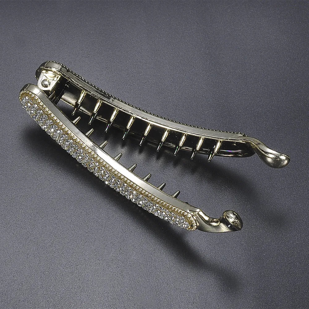 Rhinestone chicken leg banana hairpin in black, plastic with rhinestone diamond inlay, approx 10cm long.