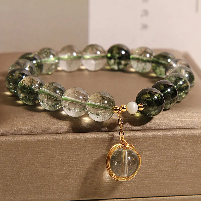 Green phantom quartz and chorite crystal bracelet with winding transfer beads