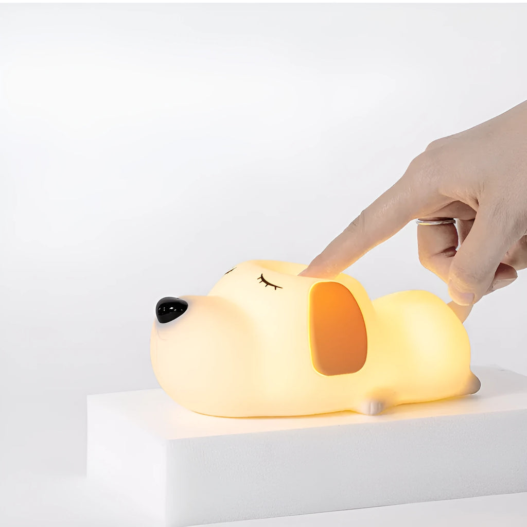 Silicone cartoon dog night lamp in two colours with a USB charging cable.