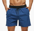Men's blue drawstring athletic shorts with a zip pocket and stitching detail on the waistband.