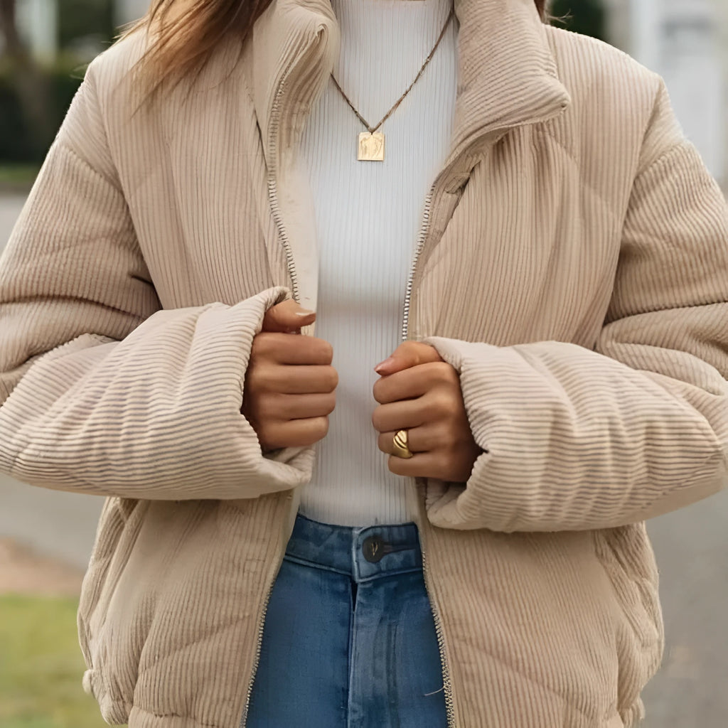 Apricot coloured women's corduroy jacket with a stand collar and full-length zipper.