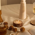 Simple modern pastoral wood candle holder with 4 candles on a table for holiday decoration