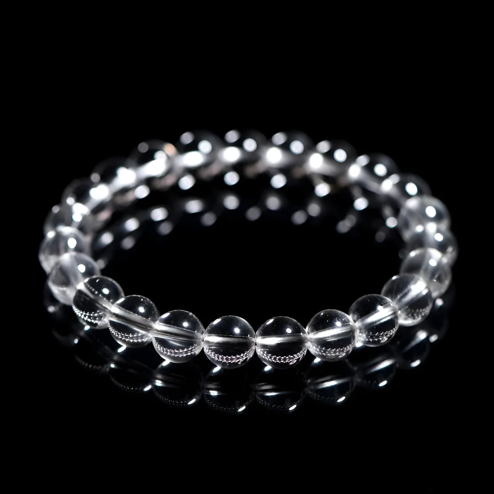 Natural Donghai white crystal round bead bracelet with geometric single circle design on a wrist.
