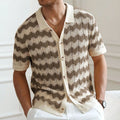 Man's short-sleeve blue sweater with a textured corduroy-like jacquard pattern, showing detail of the fabric weave.