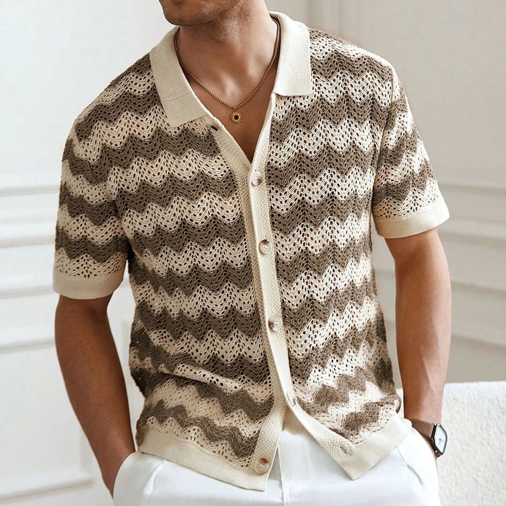 Man's short-sleeve blue sweater with a textured corduroy-like jacquard pattern, showing detail of the fabric weave.