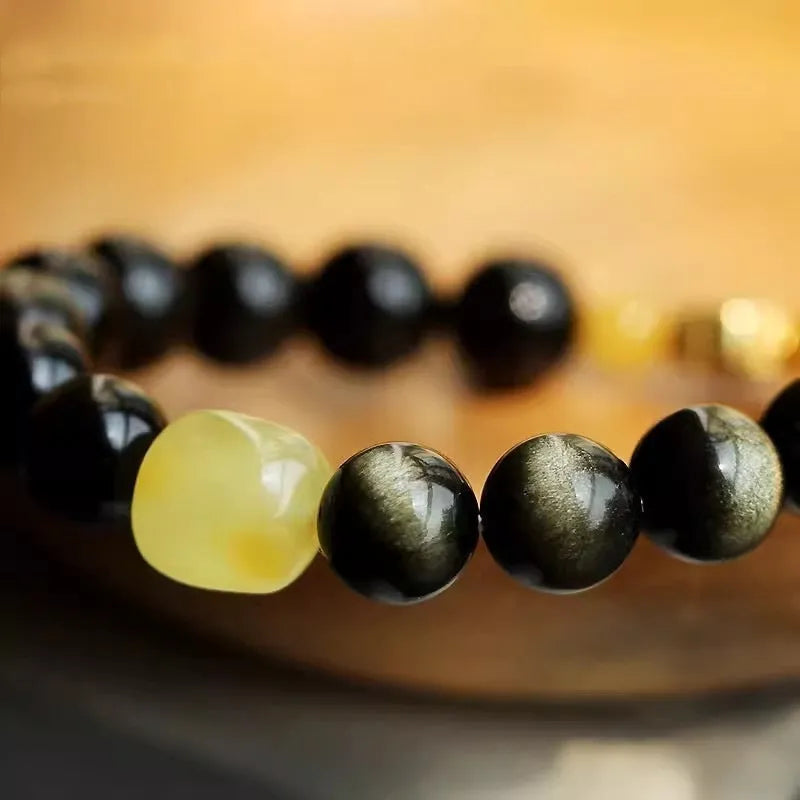 Golden obsidian ethnic bracelet with geometric shape and Chinese zodiac animal charm