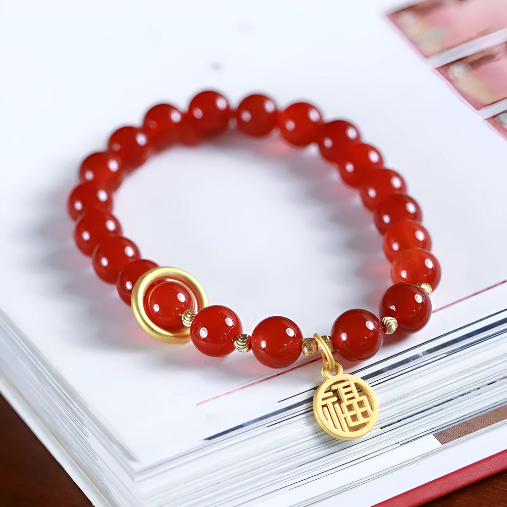 Natural red agate bracelet with woven design and blessing card, shown in 10mm bead size.
