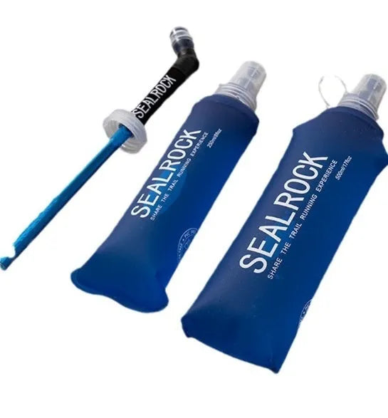 Close-up of a portable plastic drinking straw with bite valve, shown next to a sports bottle cap.